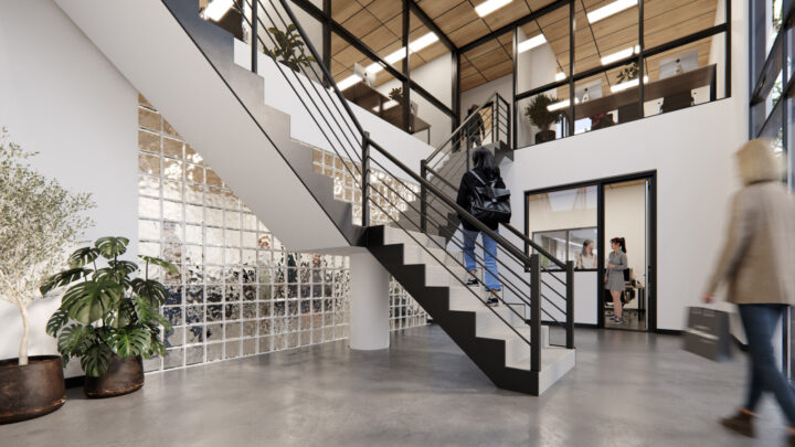 Members walking up stairs in office corridor.
